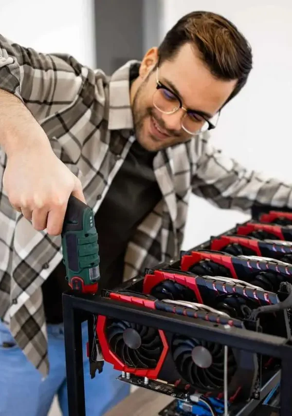 man-assembling-new-bitcoin-mining-rig-scaled